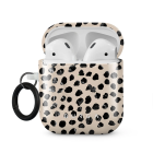 Open Apple AirPods case with a stylish leopard print pattern.