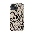 dot design on case placed on phone