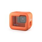 orange floaty case placed over gopro