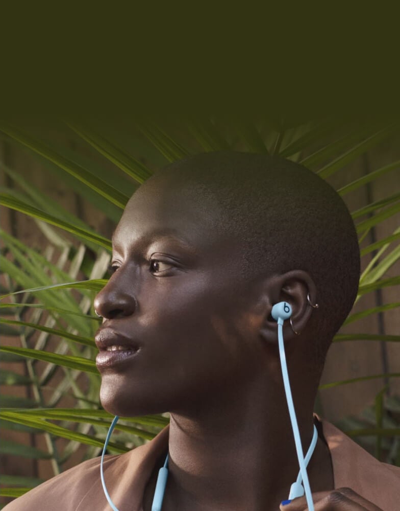 Beats Flex earbuds being worn and enjoyed by a user