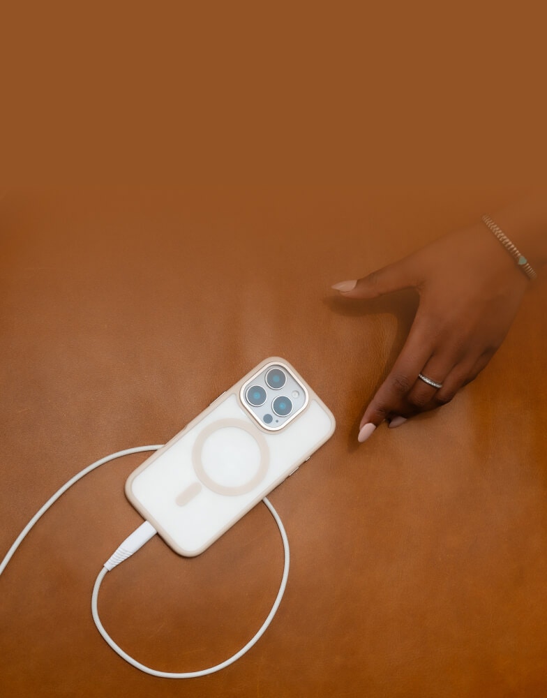 An image of an iPhone being powered up by a charging cable.