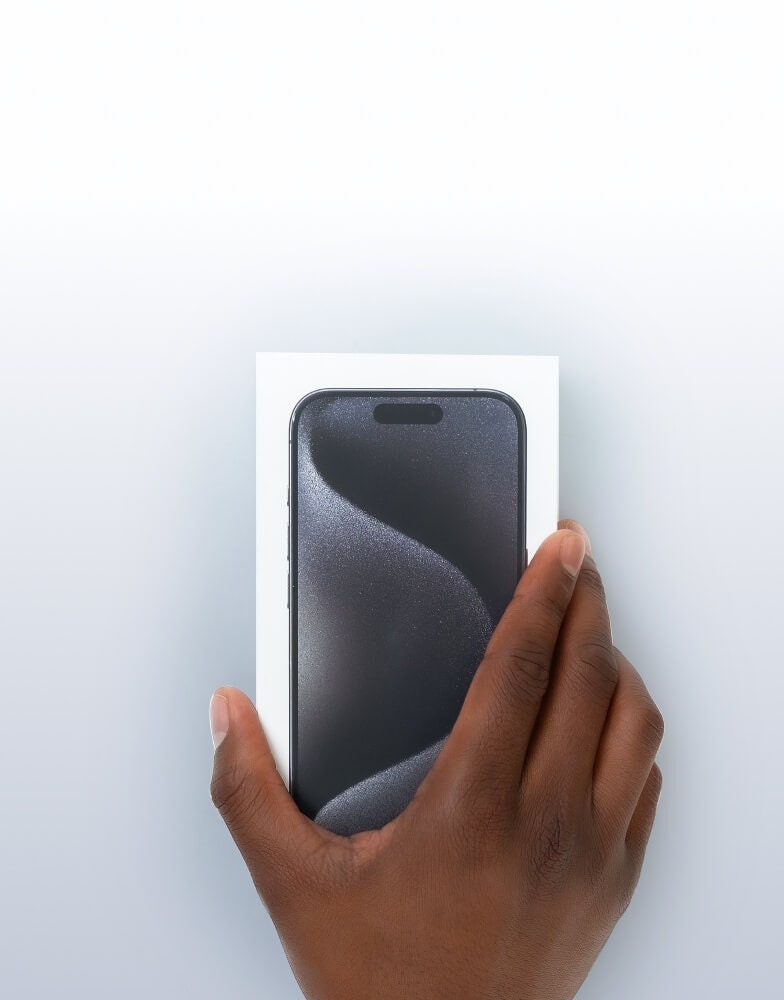 Hand holding iPhone in box