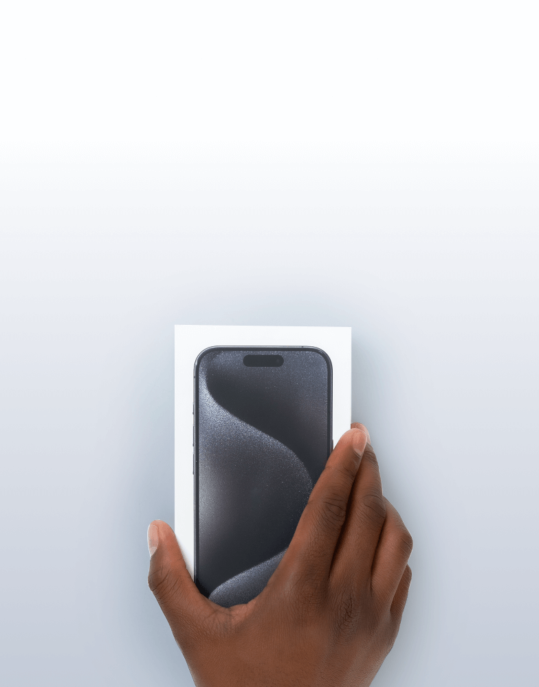 Hand holding iPhone in box