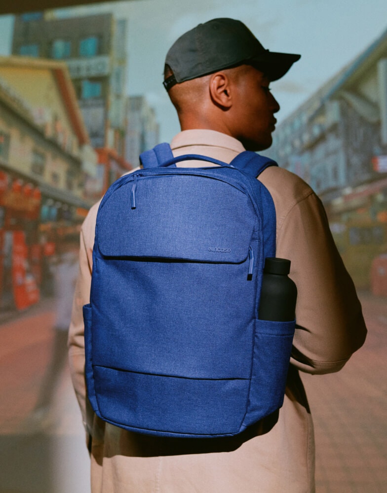 Person carrying laptop backpack