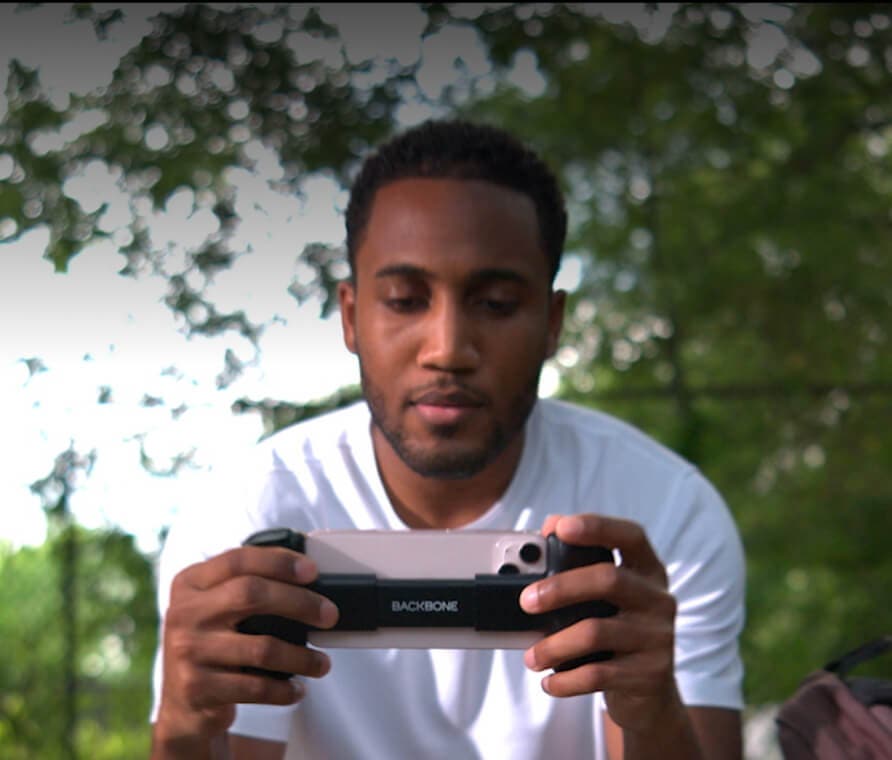 Man playing handheld console