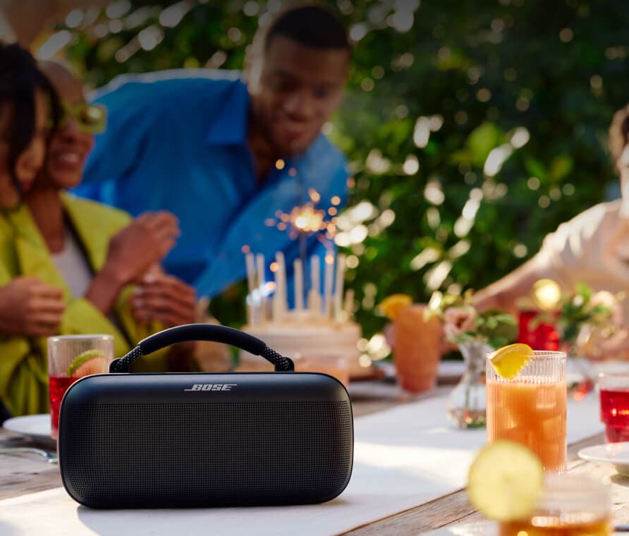 People having a party outside with speaker