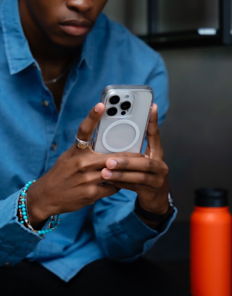 Person holding iPhone with cover