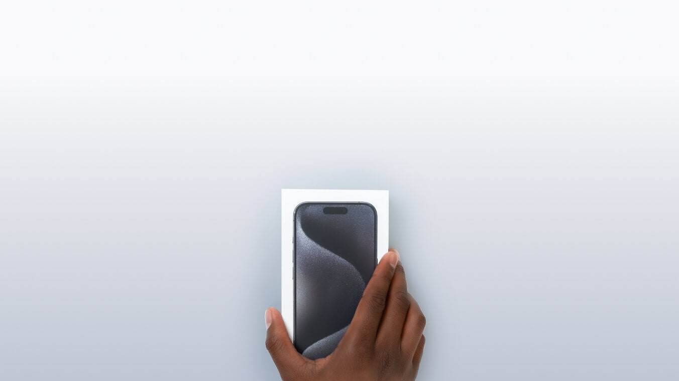 Person holding iPhone box